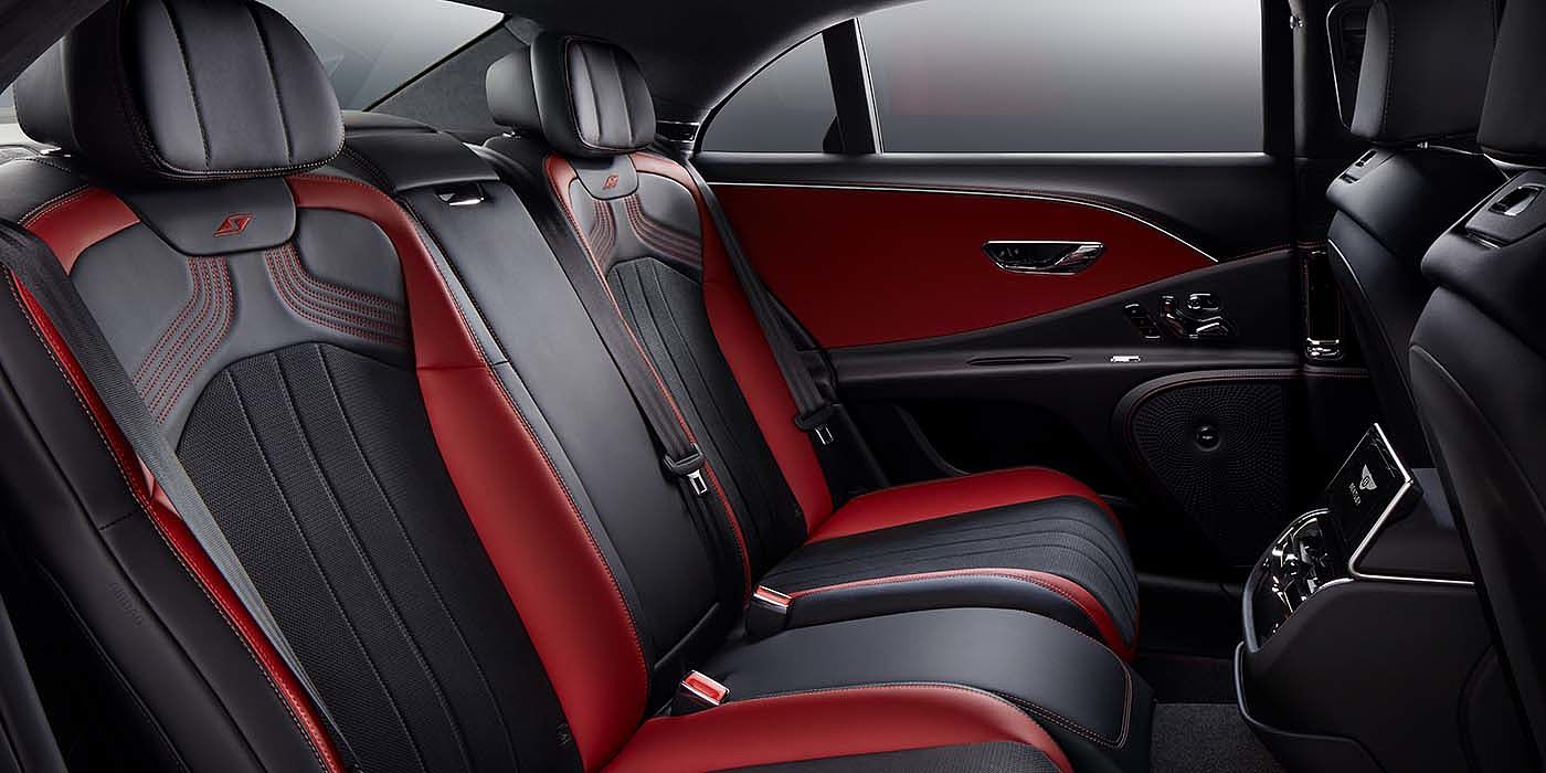 Bentley Braga Bentley Flying Spur S sedan rear interior in Beluga black and Hotspur red hide with S stitching