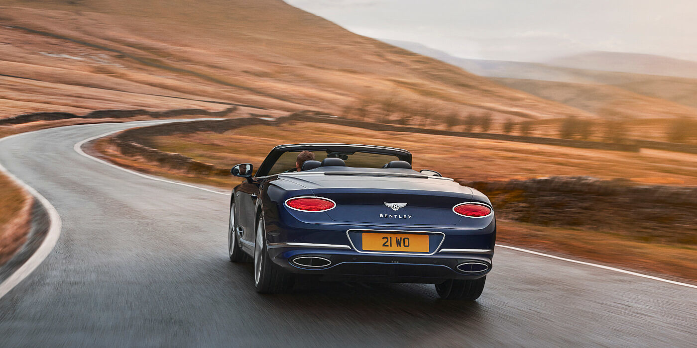 <new-bentley-continental-gt-speed-convertible-in-peacock- blue-rear-three-quarter-in-peak-district> 

